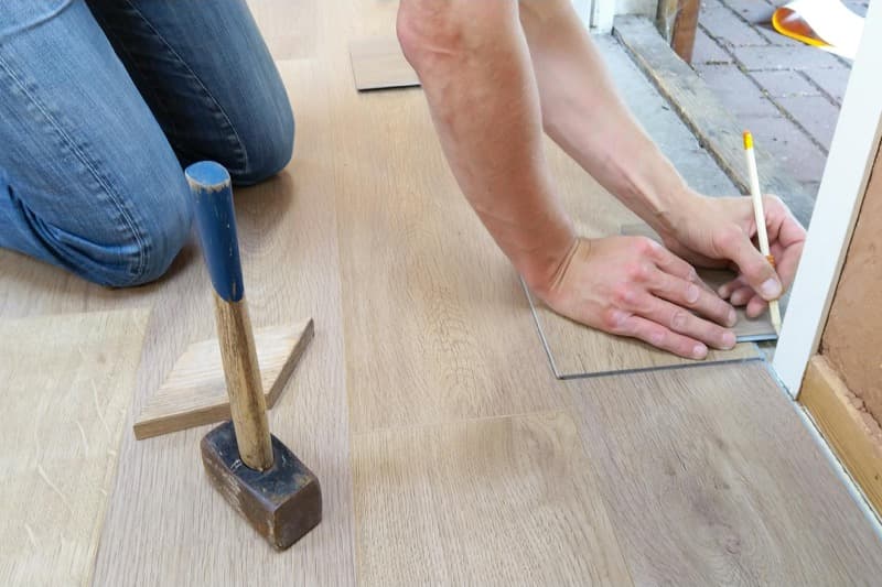 comparison of hardwood, LVP, tile, and carpet flooring materials